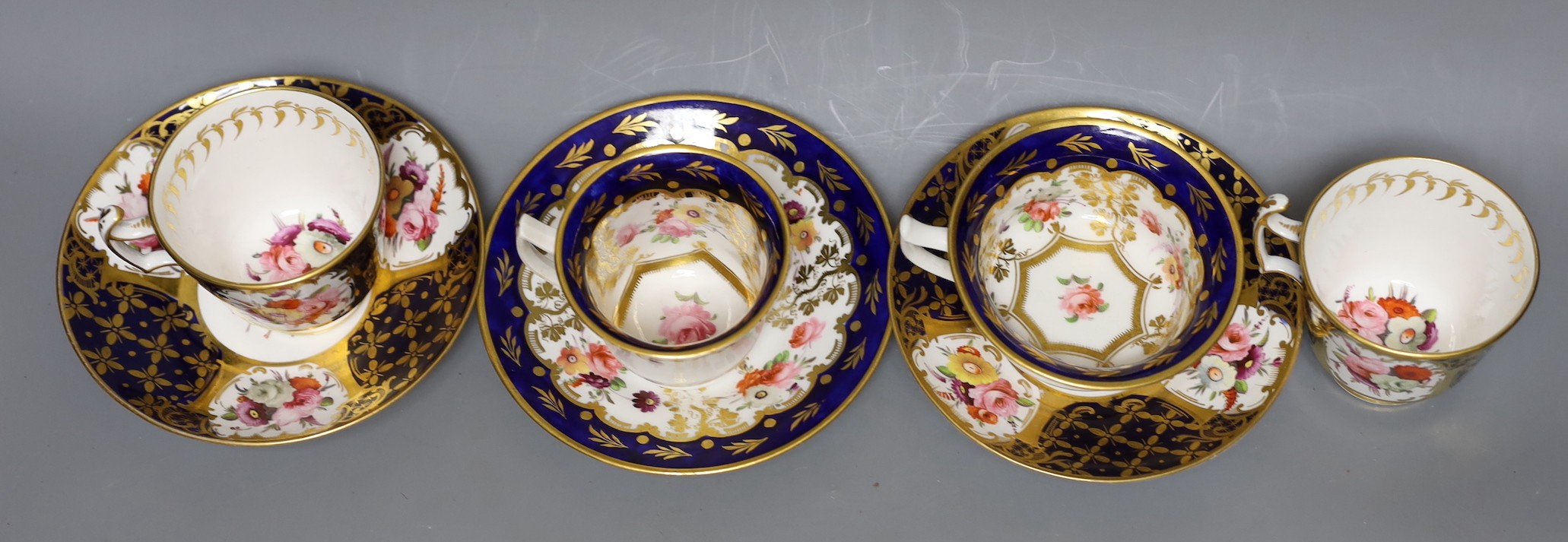An early 19th century pair of Coalport coffee cups and saucer painted with pattern 793 and a New Hall Coffee cup, teacup and saucer, See M. Messanger, Coalport, page 168, plate 114 for pattern 793, New hall cup 6.5 cms h
